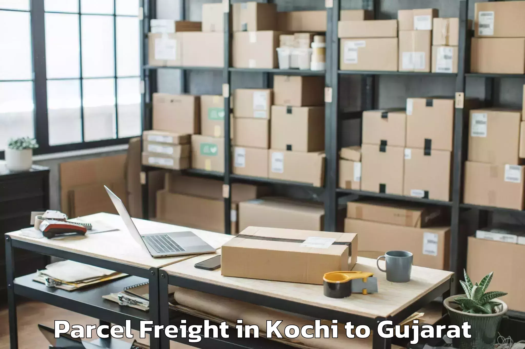 Book Kochi to Gusar Parcel Freight Online